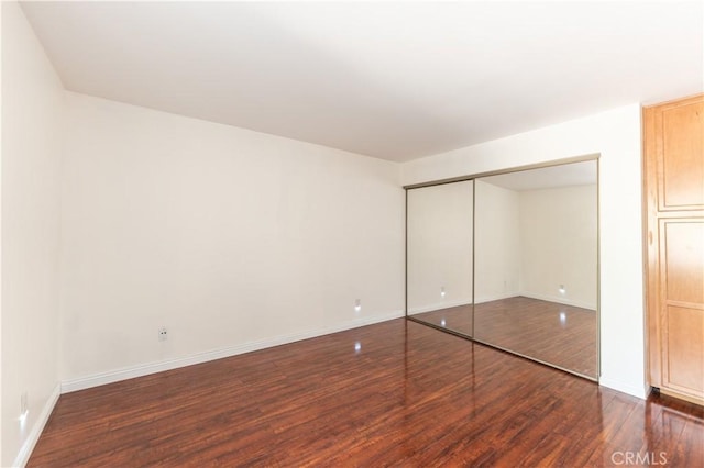 1317 Massachusetts Ave Unit 202, Riverside, CA 92507 - unfurnished bedroom with wood finished floors and a closet