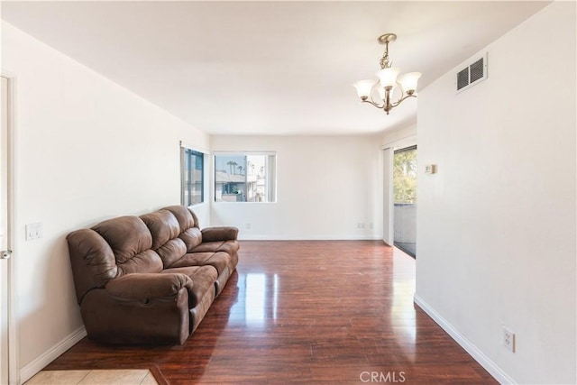 1317 Massachusetts Ave Unit 202, Riverside, CA 92507 - living area featuring a chandelier and wood finished floors