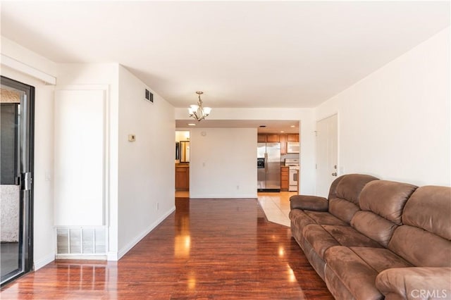 1317 Massachusetts Ave Unit 202, Riverside, CA 92507 - living room with wood finished floors and a chandelier