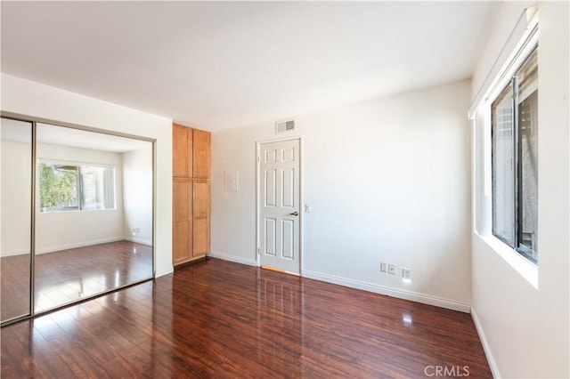 1317 Massachusetts Ave Unit 202, Riverside, CA 92507 - unfurnished bedroom featuring wood finished floors and a closet
