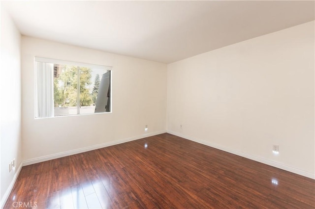 1317 Massachusetts Ave Unit 202, Riverside, CA 92507 - unfurnished room featuring dark wood-type flooring and baseboards