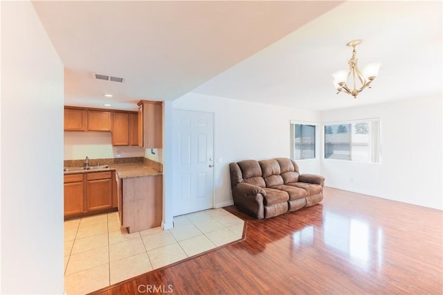 1317 Massachusetts Ave Unit 202, Riverside, CA 92507 - living area with a chandelier, light wood-style flooring, and recessed lighting
