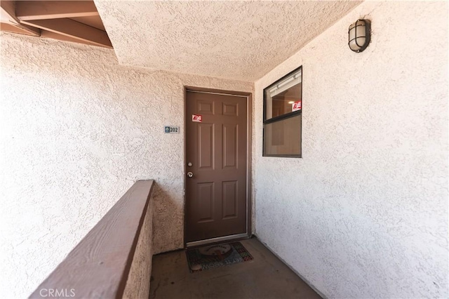 1317 Massachusetts Ave Unit 202, Riverside, CA 92507 - view of exterior entry with stucco siding