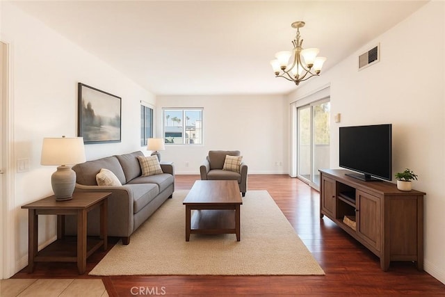 1317 Massachusetts Ave Unit 202, Riverside, CA 92507 - living room with a chandelier and wood finished floors