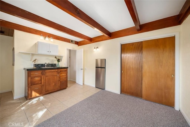 2056 Sierra Way, San Luis Obispo, CA 93401 - kitchen featuring freestanding refrigerator, beamed ceiling, dark countertops, open shelves, and light tile patterned floors