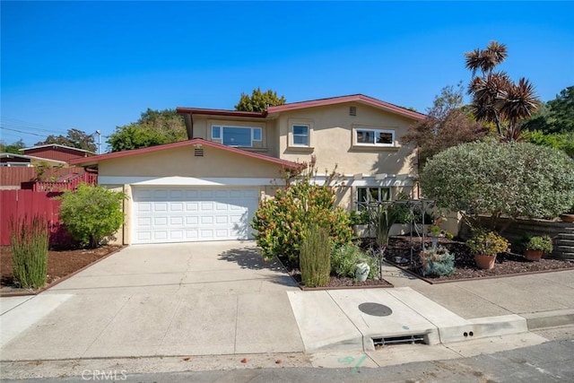 2056 Sierra Way, San Luis Obispo, CA 93401 - view of front of house featuring stucco siding, concrete driveway, and a garage