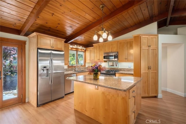 2056 Sierra Way, San Luis Obispo, CA 93401 - kitchen featuring appliances with stainless steel finishes, light wood finished floors, light stone counters, light brown cabinets, and a center island
