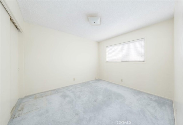 5361 Ludlow Ave, Garden Grove, CA 92845 - spare room featuring light carpet and a textured ceiling