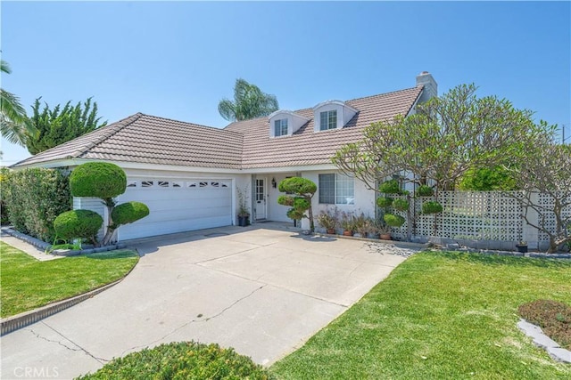 5361 Ludlow Ave, Garden Grove, CA 92845 - view of front facade with a chimney, a garage, stucco siding, a tile roof, and driveway