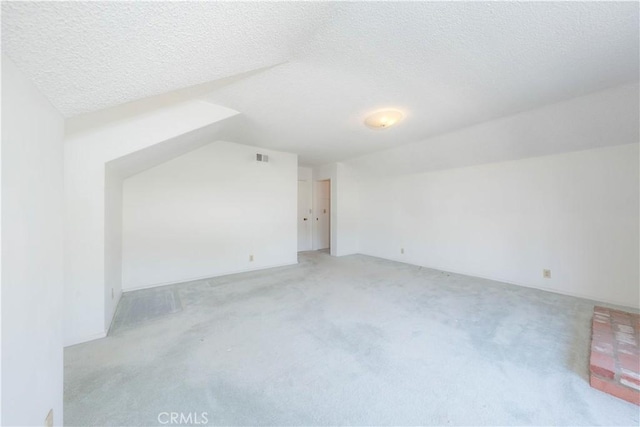 5361 Ludlow Ave, Garden Grove, CA 92845 - additional living space featuring light carpet, a textured ceiling, and lofted ceiling