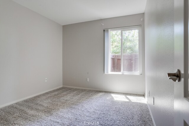 3456 Castle Glen Dr Unit 154, San Diego, CA 92123 - empty room with carpet flooring and baseboards