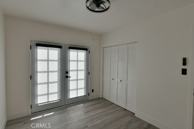 4820 W 142nd St, Hawthorne, CA 90250 - doorway to outside with french doors and light wood-style flooring