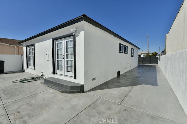 4820 W 142nd St, Hawthorne, CA 90250 - view of home's exterior featuring french doors, a fenced backyard, a patio, and crawl space