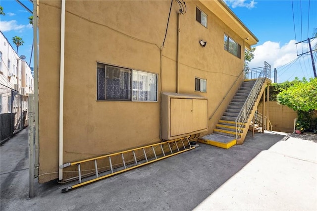 5923 Carlton Way, Los Angeles, CA 90028 - view of home's exterior featuring stairway and stucco siding