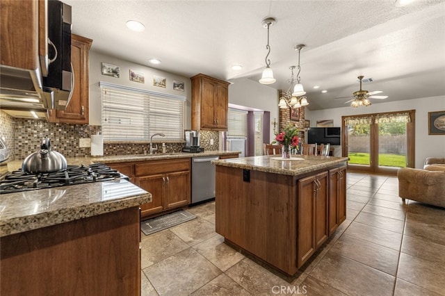 43419 37th St W, Lancaster, CA 93536 - kitchen featuring stainless steel dishwasher, tasteful backsplash, open floor plan, a center island, and ceiling fan