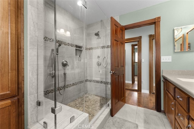 43419 37th St W, Lancaster, CA 93536 - full bathroom featuring vanity, a stall shower, and tile patterned flooring