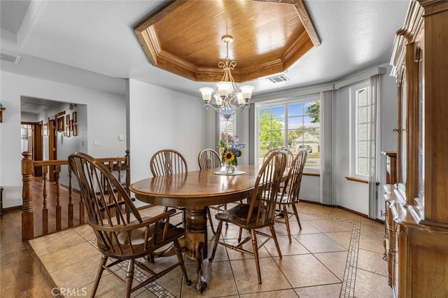 43419 37th St W, Lancaster, CA 93536 - dining area featuring a raised ceiling, a chandelier, crown molding, and light tile patterned floors