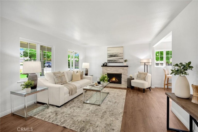 229 W Hacienda Dr, Corona, CA 92882 - living room featuring wood finished floors, plenty of natural light, and a fireplace