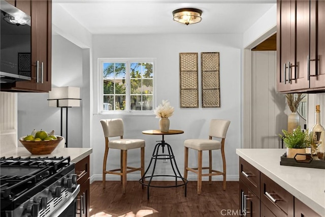 229 W Hacienda Dr, Corona, CA 92882 - kitchen with light countertops, dark wood-type flooring, and dark brown cabinetry