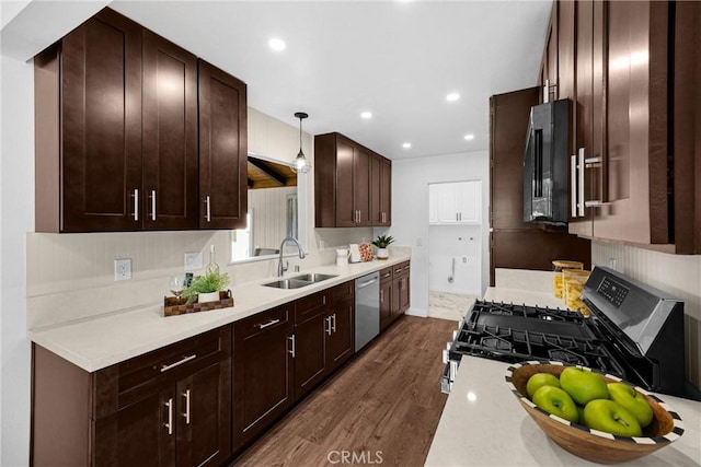 229 W Hacienda Dr, Corona, CA 92882 - kitchen featuring appliances with stainless steel finishes, dark wood finished floors, light countertops, dark brown cabinetry, and recessed lighting