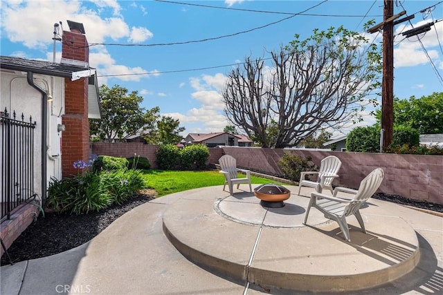 229 W Hacienda Dr, Corona, CA 92882 - fenced backyard featuring a patio area and an outdoor fire pit