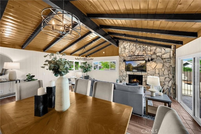 229 W Hacienda Dr, Corona, CA 92882 - dining area with wood ceiling, a chandelier, a stone fireplace, and wood finished floors