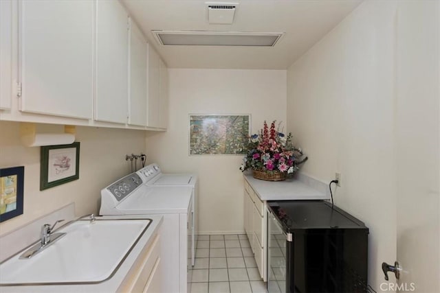 548 Via Ln, Paloma, Riverside, CA 92507 - washroom featuring cabinet space, washing machine and dryer, light tile patterned floors, and attic access