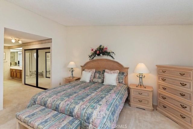 548 Via Ln, Paloma, Riverside, CA 92507 - bedroom with light carpet, a closet, and ensuite bathroom