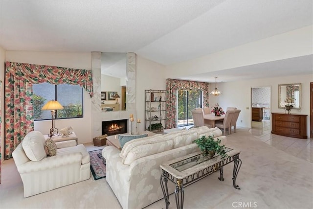 548 Via Ln, Paloma, Riverside, CA 92507 - living area with lofted ceiling, a warm lit fireplace, and carpet