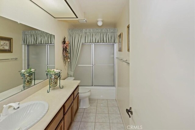 548 Via Ln, Paloma, Riverside, CA 92507 - full bathroom featuring vanity, tile patterned flooring, and bath / shower combo with glass door