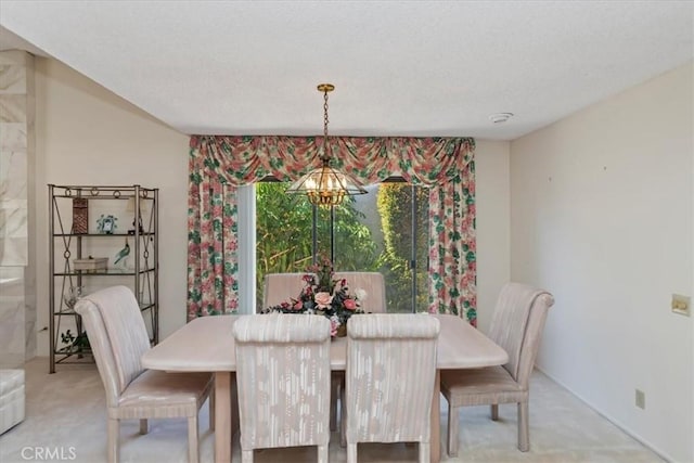 548 Via Ln, Paloma, Riverside, CA 92507 - dining area featuring light carpet, a chandelier, and a textured ceiling