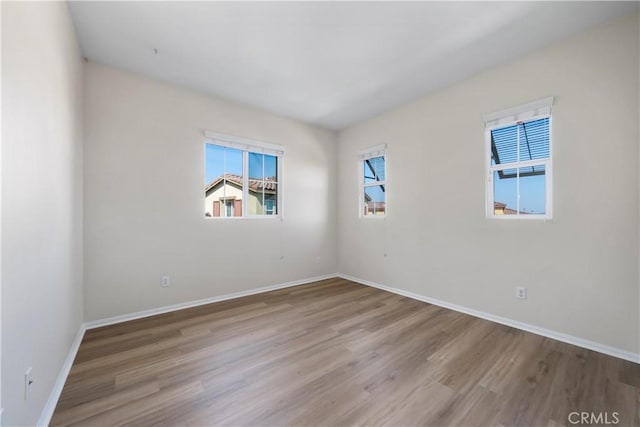 8022 Cresta Bella Rd, Rancho Cucamonga, CA 91730 - empty room featuring wood finished floors and baseboards