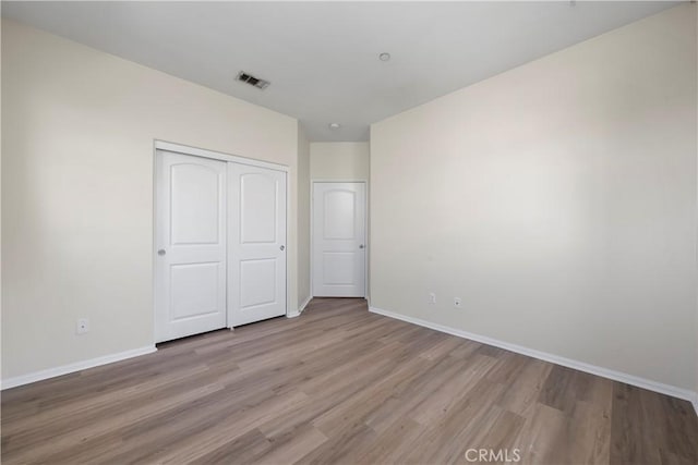8022 Cresta Bella Rd, Rancho Cucamonga, CA 91730 - unfurnished bedroom featuring wood finished floors and a closet