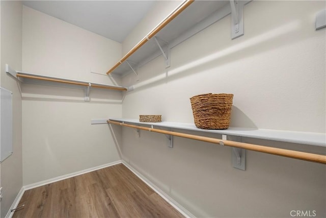 8022 Cresta Bella Rd, Rancho Cucamonga, CA 91730 - walk in closet with wood finished floors