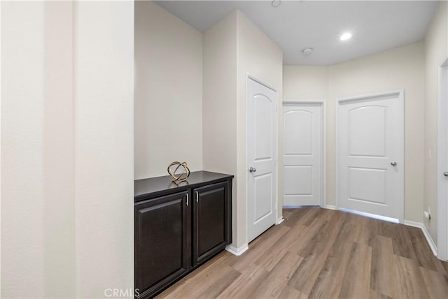 8022 Cresta Bella Rd, Rancho Cucamonga, CA 91730 - hallway featuring light wood-style floors and recessed lighting