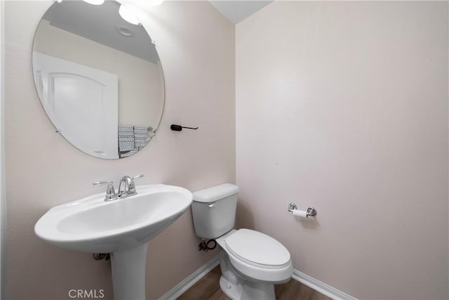 8022 Cresta Bella Rd, Rancho Cucamonga, CA 91730 - bathroom with toilet and wood finished floors