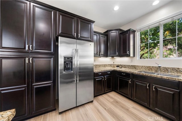 8022 Cresta Bella Rd, Rancho Cucamonga, CA 91730 - kitchen with stainless steel fridge with ice dispenser, light stone counters, light wood-type flooring, and recessed lighting