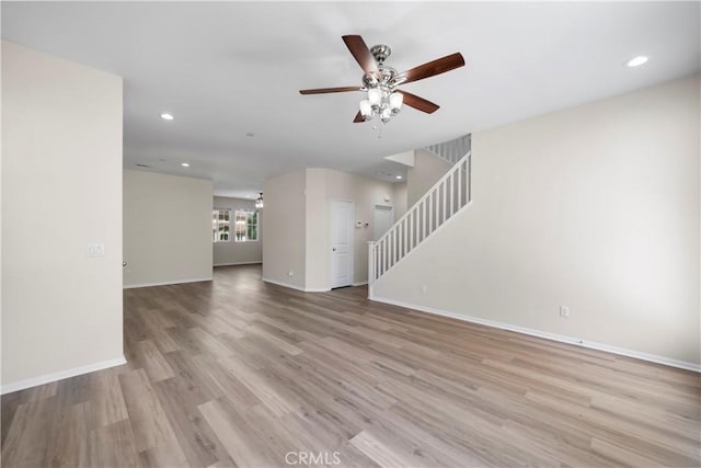 8022 Cresta Bella Rd, Rancho Cucamonga, CA 91730 - unfurnished living room with ceiling fan, stairs, wood finished floors, and recessed lighting