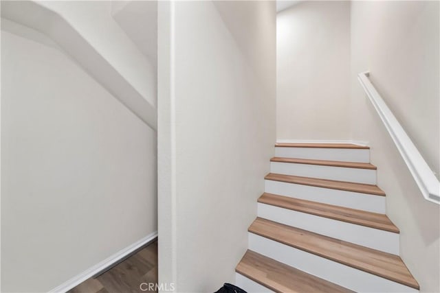 8022 Cresta Bella Rd, Rancho Cucamonga, CA 91730 - stairs featuring wood finished floors and baseboards