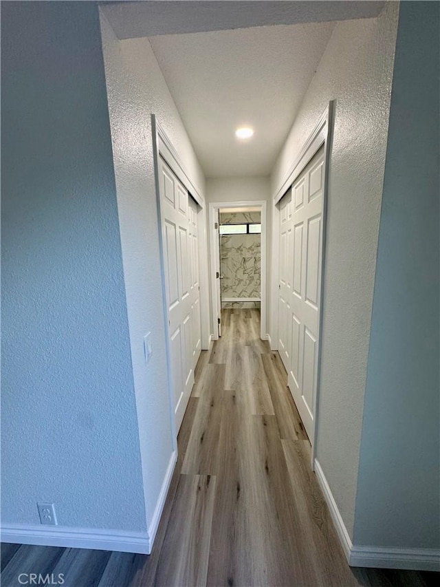 1 Paddle Ct, Sacramento, CA 95833 - corridor featuring wood finished floors and a textured wall
