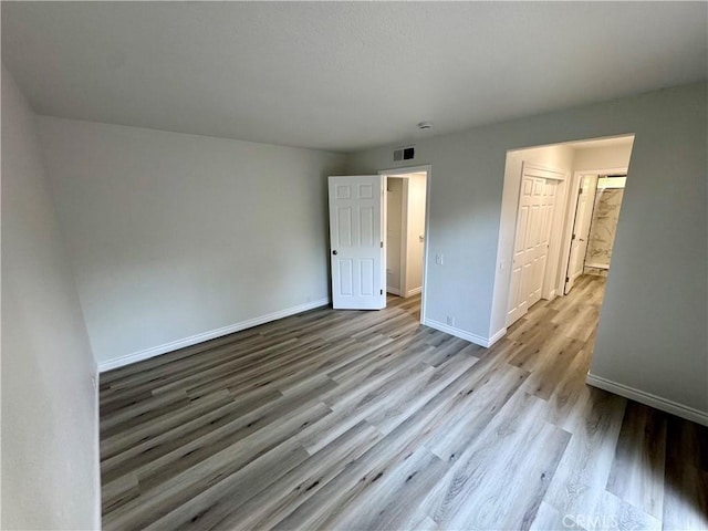 1 Paddle Ct, Sacramento, CA 95833 - unfurnished bedroom featuring baseboards and wood finished floors