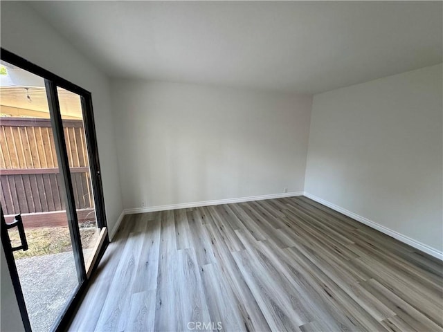 1 Paddle Ct, Sacramento, CA 95833 - empty room with healthy amount of natural light and wood finished floors