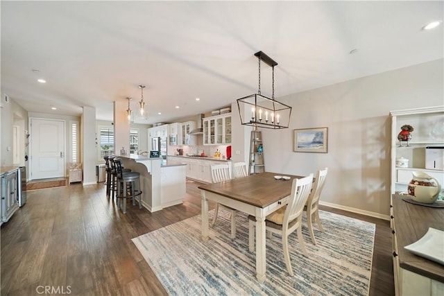 4048 Tradewinds Dr, Oxnard, CA 93035 - dining room with dark wood finished floors and recessed lighting