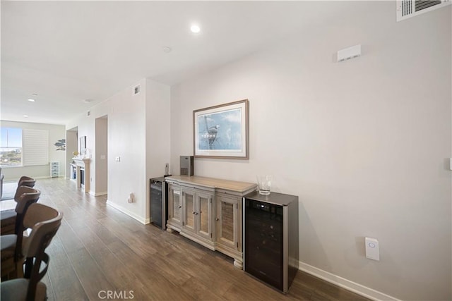 4048 Tradewinds Dr, Oxnard, CA 93035 - indoor dry bar with beverage cooler, dark wood finished floors, and recessed lighting