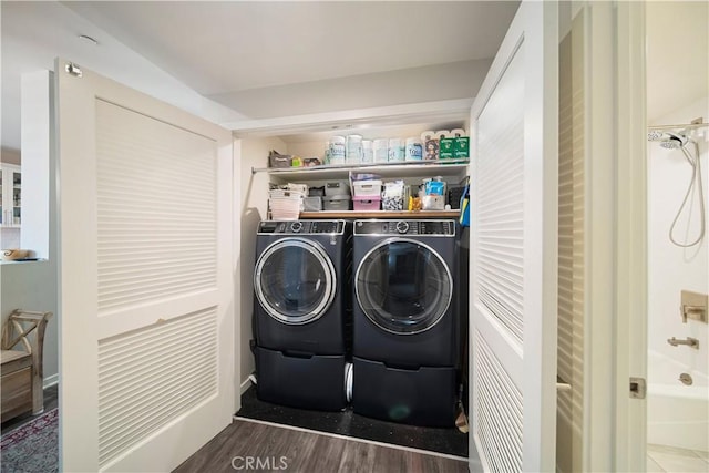 4048 Tradewinds Dr, Oxnard, CA 93035 - washroom with separate washer and dryer and wood finished floors