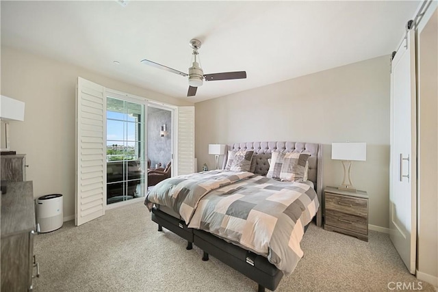 4048 Tradewinds Dr, Oxnard, CA 93035 - bedroom with a barn door, access to outside, light carpet, and ceiling fan