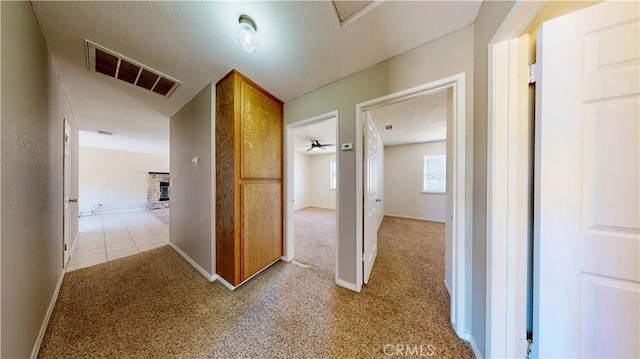 19171 Carlisle Rd, Apple Valley, CA 92307 - hallway featuring light colored carpet and a textured ceiling