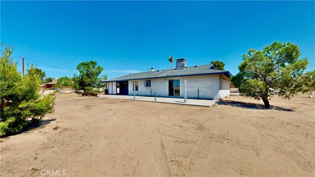 19171 Carlisle Rd, Apple Valley, CA 92307 - rear view of property with a patio area and stucco siding