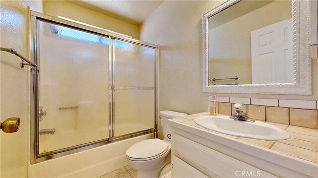 19171 Carlisle Rd, Apple Valley, CA 92307 - full bath with vanity, shower / bath combination with glass door, and tasteful backsplash