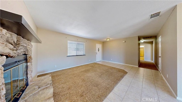 19171 Carlisle Rd, Apple Valley, CA 92307 - unfurnished living room with a fireplace and light tile patterned floors